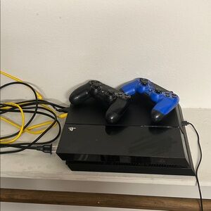 Sony Console with Black and Blue Controllers